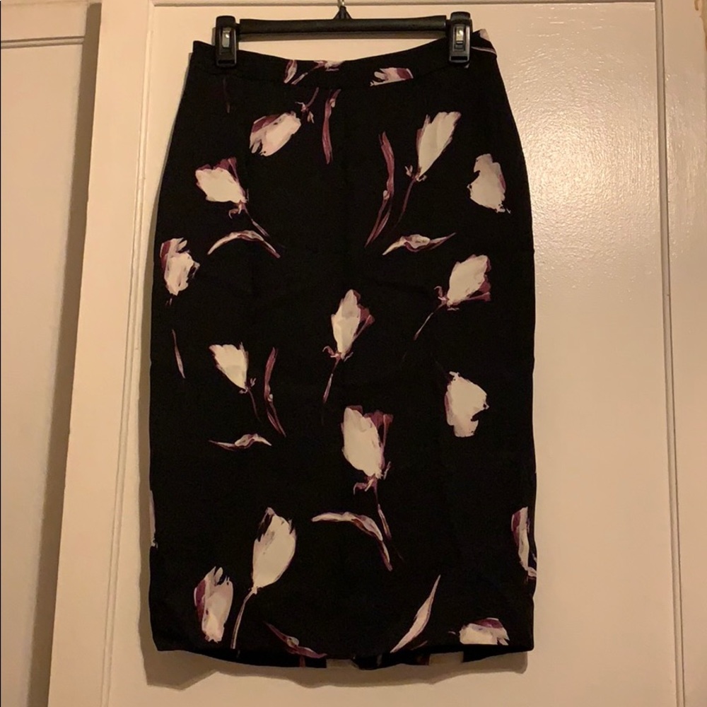 Black pencil skirt with purple/white flowers.